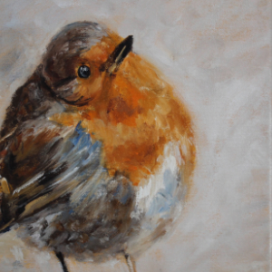 British Robin looking up and to the right on a beige background