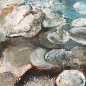 Semi-abstract close up of ice and rocks along a shoreline.