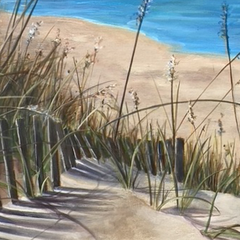Beach scene on a very bright and sunny blue-sky day. There is soft clouds in the sky. In the foreground to the left, there is a sand fence that has some tall grasses behind it.